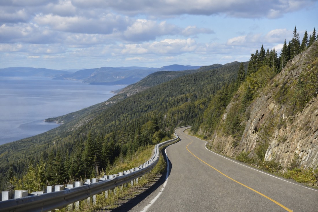 Route 138 winding through Charlevoix hills toward the St. Lawrence on the drive from Quebec City to Tadoussac