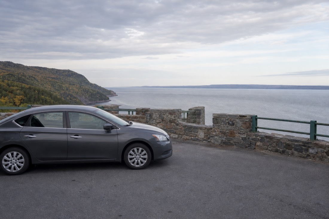 Rental car parked at a lookout over the St. Lawrence River east of Quebec City