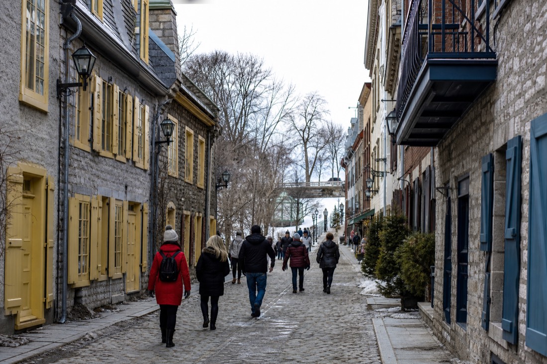 Pedestrians walking the narrow cobblestone rue du Petit-Champlain in Lower Town Quebec City