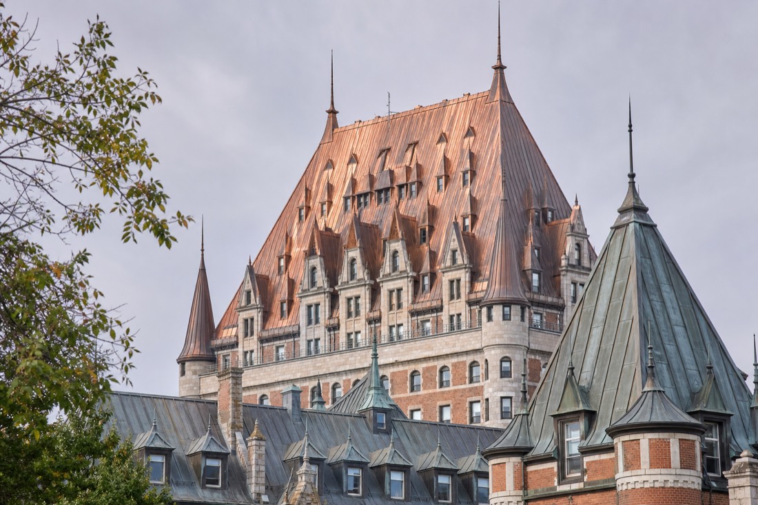 The copper roofs and turrets of the Château Frontenac above Dufferin Terrace in Quebec City